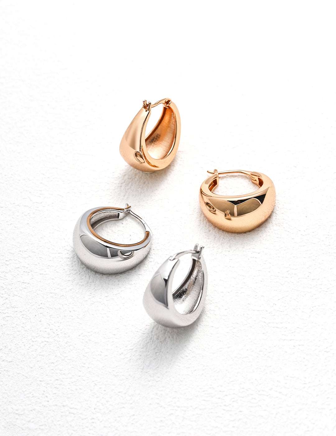 Naked Resonance Earrings — product on white background