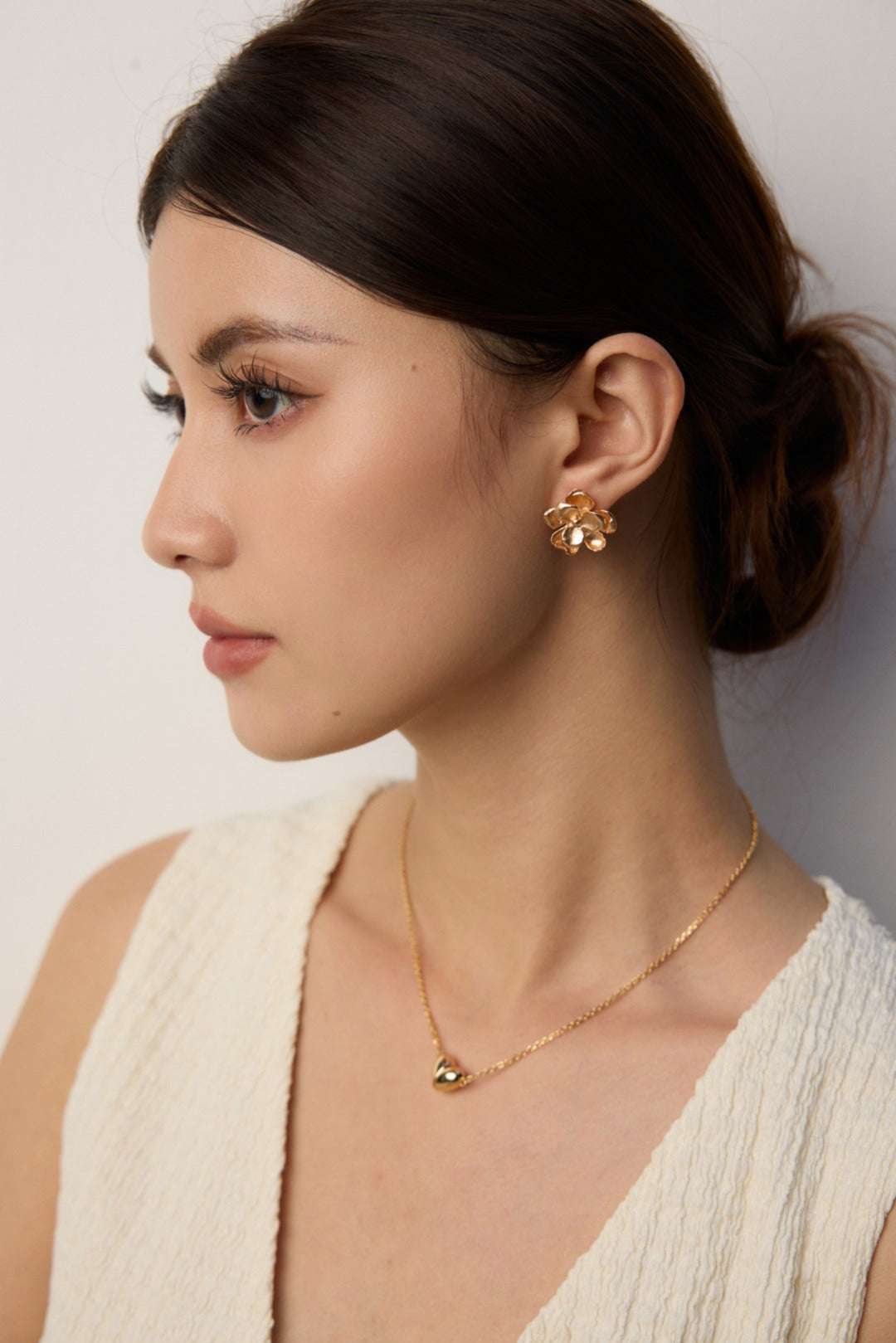 Botanic Radiance Silhouette — on‑model ear shot showing negative‑space petal silhouette｜Forya J'adore