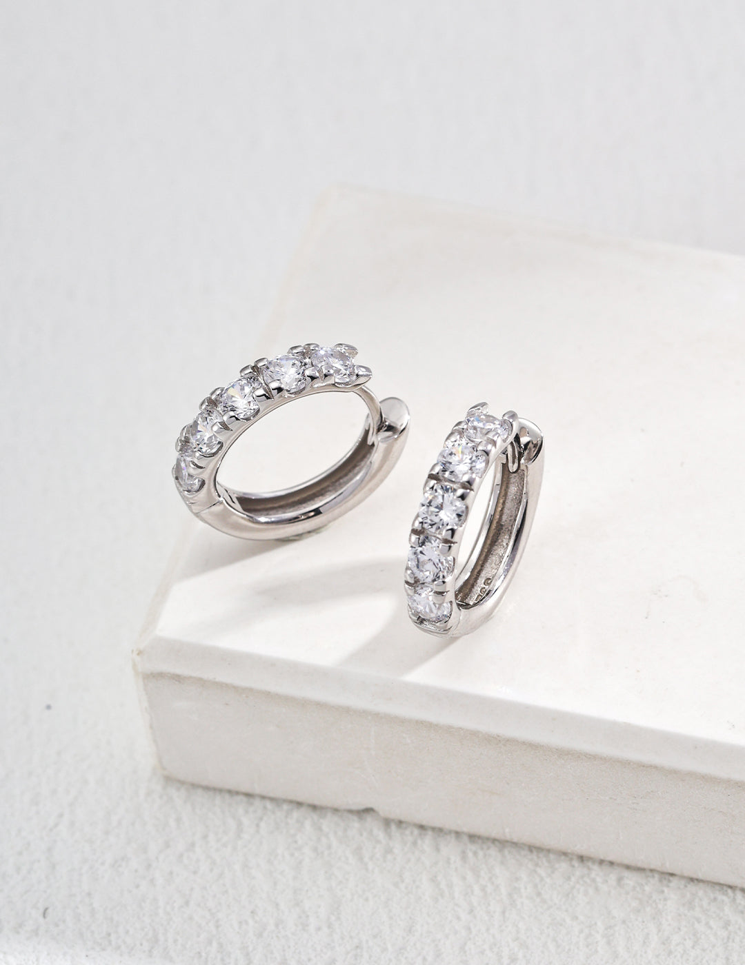 Prism Whisper — pair of matte-framed zirconia orbit studs on neutral background｜Forya J'adore